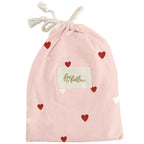 Fox & Fallow pink bassinet fitted sheet with red heart print in cotton bag
