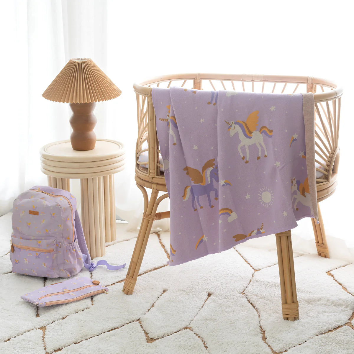 photoshoot of Fox & Fallow backpack for kids, perfect for school, daycare and everyday use. Spacious, practical and designed for little adventures. Personalisation of embroidery with name also available on bags in 2 placements. This print is unicorns,with matching blanket and pencil case