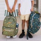 children carrying Fox & Fallow backpack for kids, perfect for school, daycare and everyday use. Spacious, practical and designed for little adventures. Personalisation of embroidery with name also available on bags in 2 placements. This print is dinos and trucks with b.box waterbottle