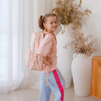 girl wearing Fox & Fallow backpack for kids, perfect for school, daycare and everyday use. Spacious, practical and designed for little adventures. Personalisation of embroidery with name also available on bags in 2 placements. This print is mermaids