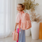 child wearing Fox & Fallow backpack for kids, perfect for school, daycare and everyday use. Spacious, practical and designed for little adventures. Personalisation of embroidery with name also available on bags in 2 placements. This print is peach check