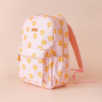 side view of Fox & Fallow backpack for kids, perfect for school, daycare and everyday use. Spacious, practical and designed for little adventures. Personalisation of embroidery with name also available on bags in 2 placements. This print is daisy chain
