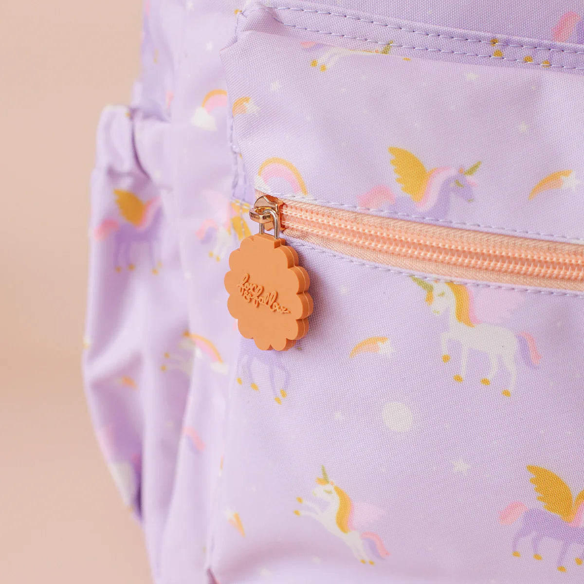 close up of Fox & Fallow backpack for kids, perfect for school, daycare and everyday use. Spacious, practical and designed for little adventures. Personalisation of embroidery with name also available on bags in 2 placements. This print is unicorns