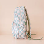 side view of pockets Fox & Fallow sage check backpack kids school bag