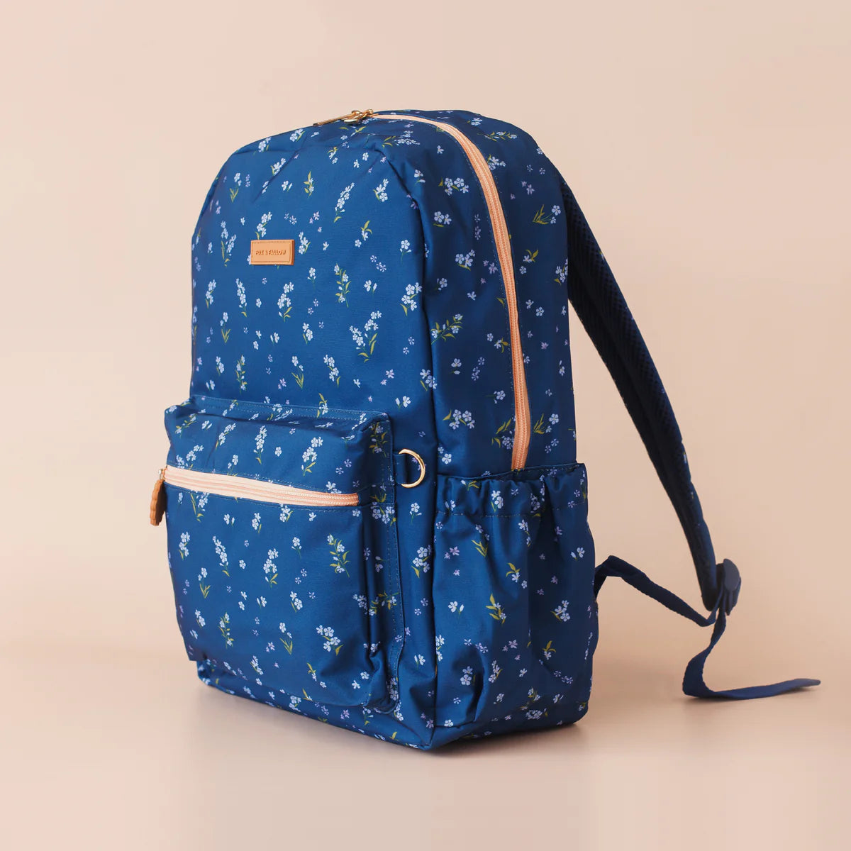 side view of Fox & Fallow backpack for kids, perfect for school, daycare and everyday use. Spacious, practical and designed for little adventures. Personalisation of embroidery with name also available on bags in 2 placements. This print is forget me not