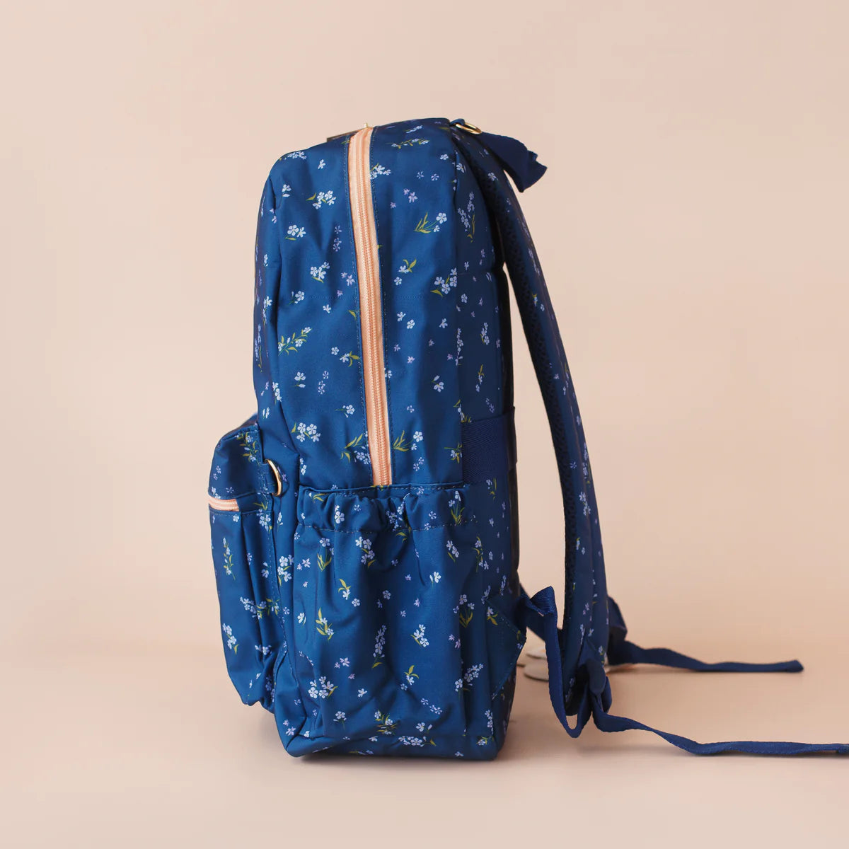 side view of pockets on Fox & Fallow backpack for kids, perfect for school, daycare and everyday use. Spacious, practical and designed for little adventures. Personalisation of embroidery with name also available on bags in 2 placements. This print is forget me not