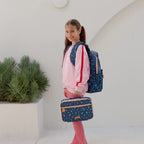 teenager side view wearing Fox & Fallow backpack for kids, perfect for school, daycare and everyday use. Spacious, practical and designed for little adventures. Personalisation of embroidery with name also available on bags in 2 placements. This print is forget me not