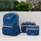 photoshoot of navy bag with florals Fox & Fallow backpack for kids, perfect for school, daycare and everyday use. Spacious, practical and designed for little adventures. Personalisation of embroidery with name also available on bags in 2 placements. This print is forget me not