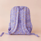 back view of straps on Fox & Fallow backpack for kids, perfect for school, daycare and everyday use. Spacious, practical and designed for little adventures. Personalisation of embroidery with name also available on bags in 2 placements. This print is juniper - lilac purple with leaves