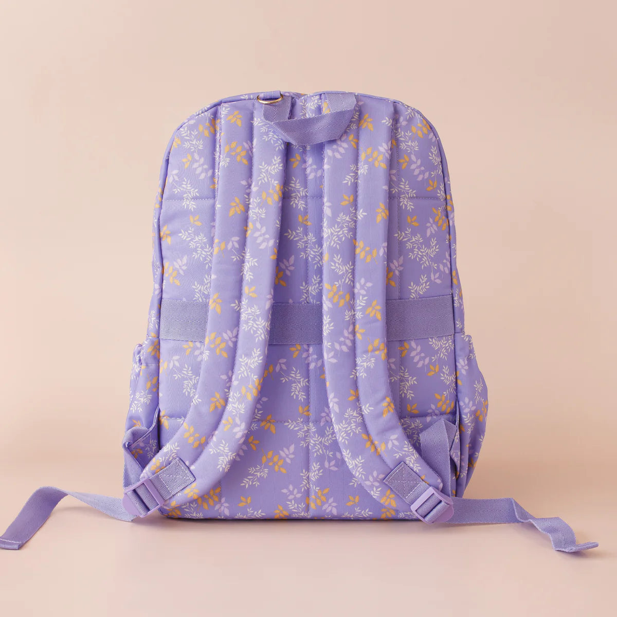 back view of straps on Fox & Fallow backpack for kids, perfect for school, daycare and everyday use. Spacious, practical and designed for little adventures. Personalisation of embroidery with name also available on bags in 2 placements. This print is juniper - lilac purple with leaves