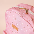 close up of modelling the Fox & Fallow backpack for kids, perfect for school, daycare and everyday use. Spacious, practical and designed for little adventures. Personalisation of embroidery with name also available on bags in 2 placements. This print is dusty roses