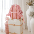bag on suitcase travel ready photo modelling the Fox & Fallow backpack for kids, perfect for school, daycare and everyday use. Spacious, practical and designed for little adventures. Personalisation of embroidery with name also available on bags in 2 placements. This print is dusty roses