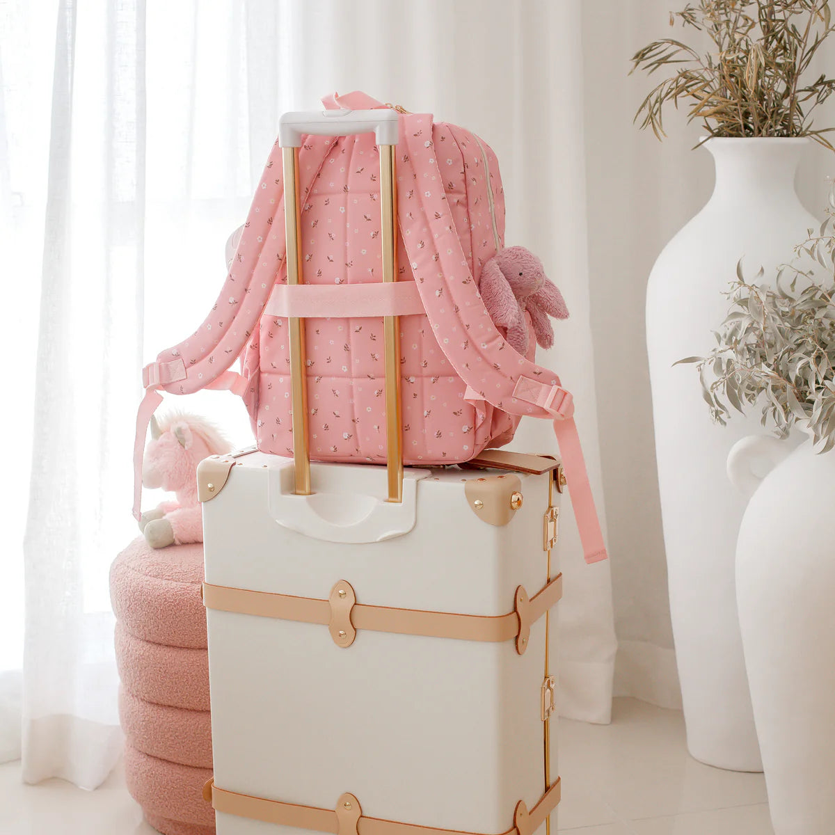 bag on suitcase travel ready photo modelling the Fox & Fallow backpack for kids, perfect for school, daycare and everyday use. Spacious, practical and designed for little adventures. Personalisation of embroidery with name also available on bags in 2 placements. This print is dusty roses