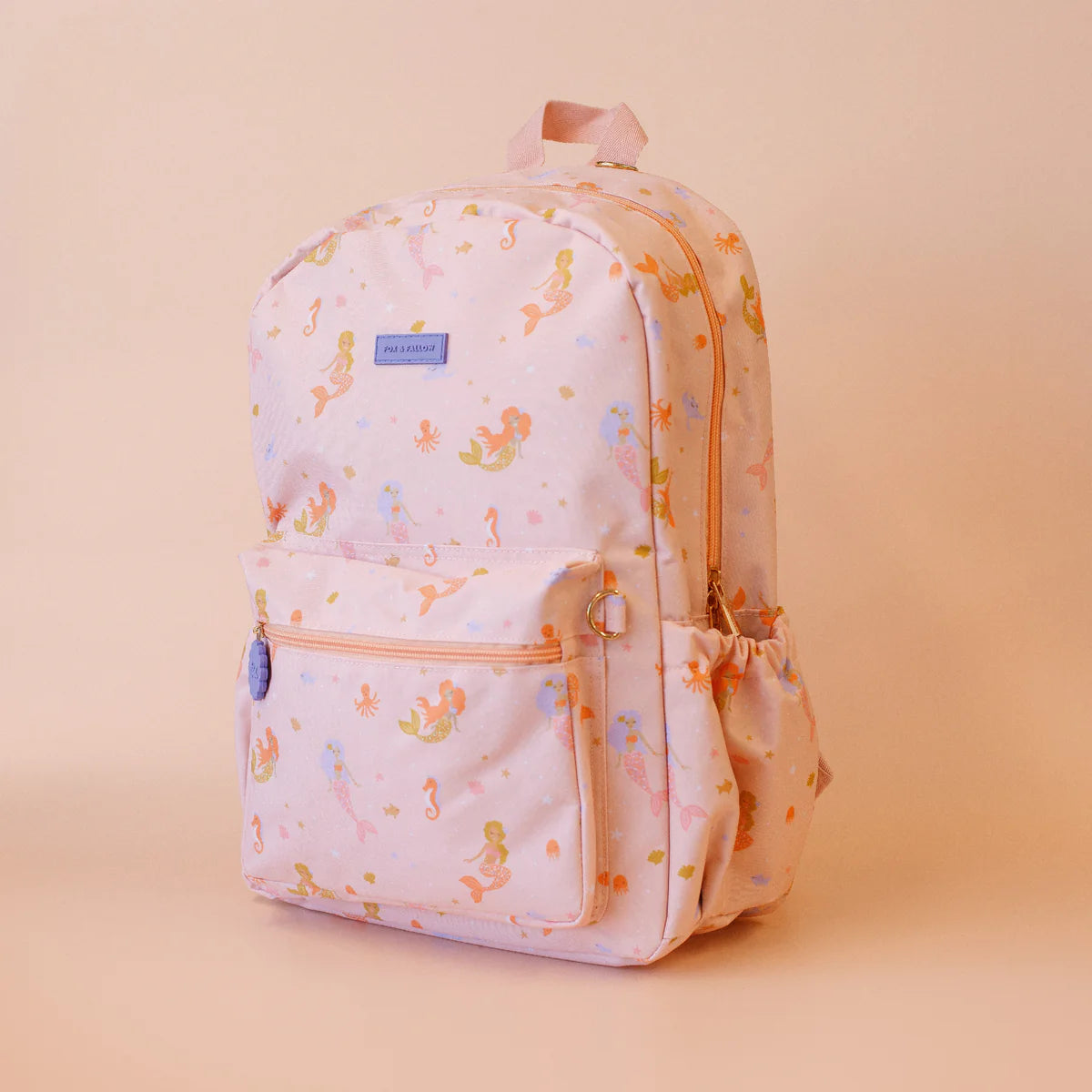side view of Fox & Fallow backpack for kids, perfect for school, daycare and everyday use. Spacious, practical and designed for little adventures. Personalisation of embroidery with name also available on bags in 2 placements. This print is mermaids