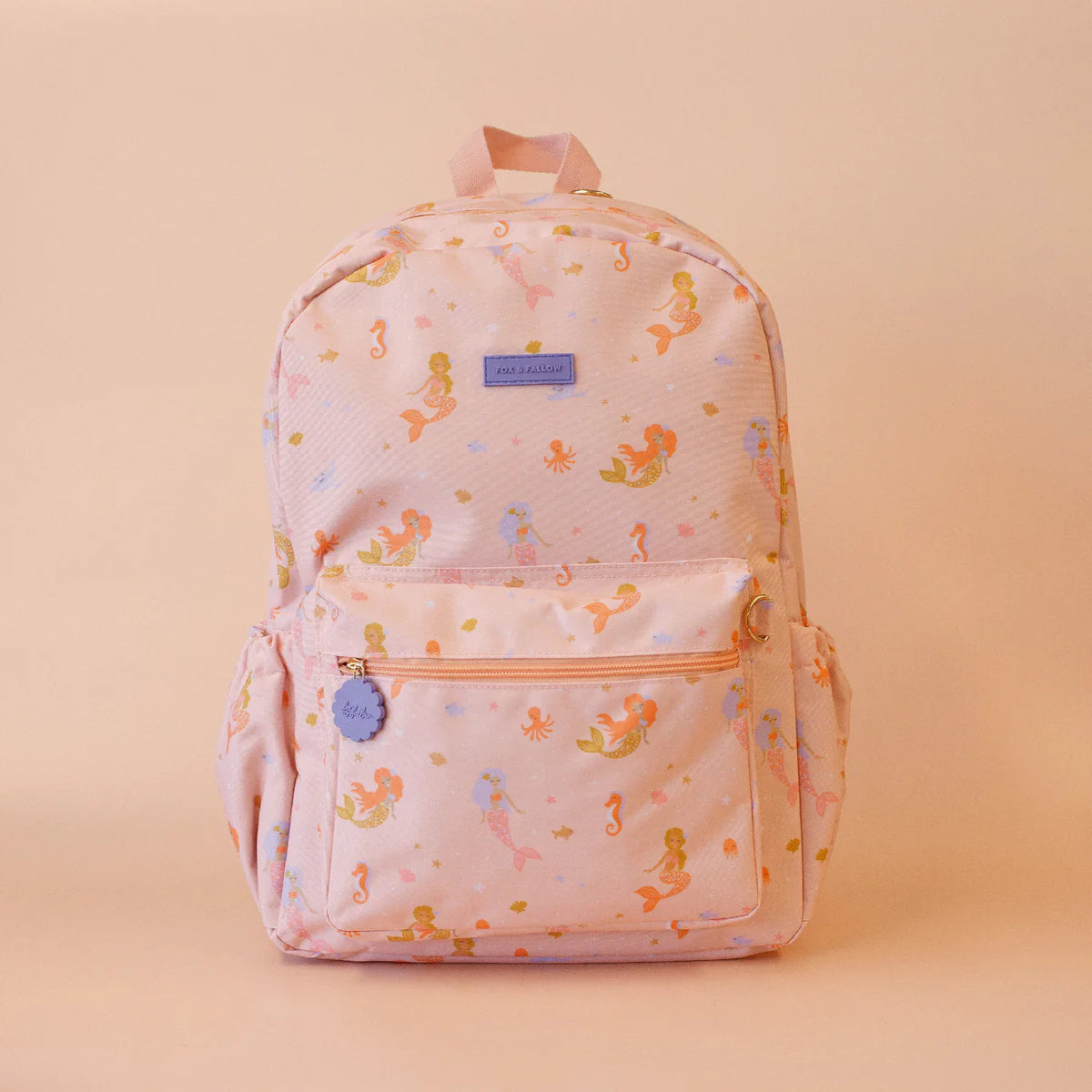 front on view of Fox & Fallow backpack for kids, perfect for school, daycare and everyday use. Spacious, practical and designed for little adventures. Personalisation of embroidery with name also available on bags in 2 placements. This print is mermaids
