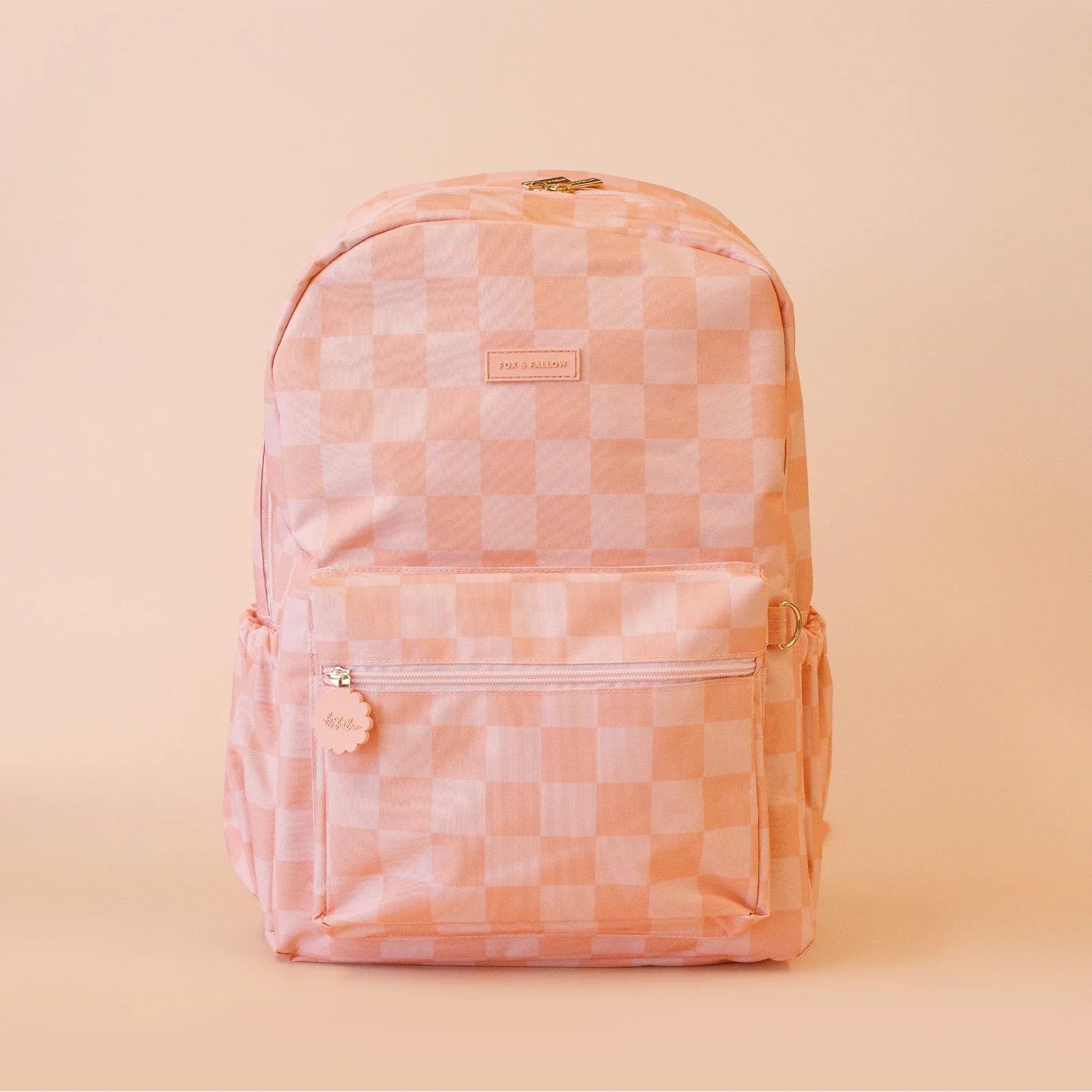 front on view of Fox & Fallow backpack for kids, perfect for school, daycare and everyday use. Spacious, practical and designed for little adventures. Personalisation of embroidery with name also available on bags in 2 placements. This print is peach check