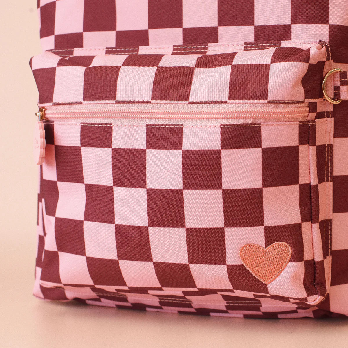 close up front pocket view of Fox & Fallow backpack for kids, perfect for school, daycare and everyday use. Spacious, practical and designed for little adventures. Personalisation of embroidery with name also available on bags in 2 placements. This print is cherry check