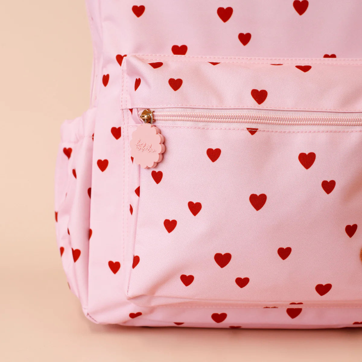 close up front zipper Fox & Fallow little hearts backpack front view kids school bag