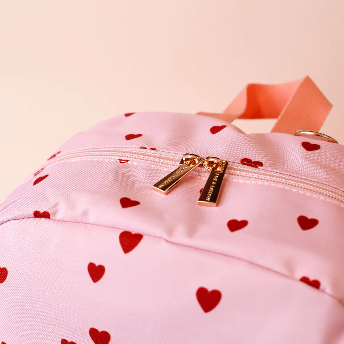 close up zipper view Fox & Fallow little hearts backpack front view kids school bag