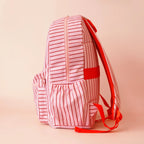 side view with pockets on child Fox & Fallow backpack for kids, perfect for school, daycare and everyday use. Spacious, practical and designed for little adventures. Personalisation of embroidery with name also available on bags in 2 placements. This print is strawberry stripe