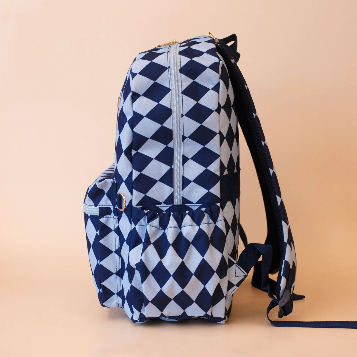 side view of pockets on Fox & Fallow backpack for kids, perfect for school, daycare and everyday use. Spacious, practical and designed for little adventures. Personalisation of embroidery with name also available on bags in 2 placements. This print is blue diamonds
