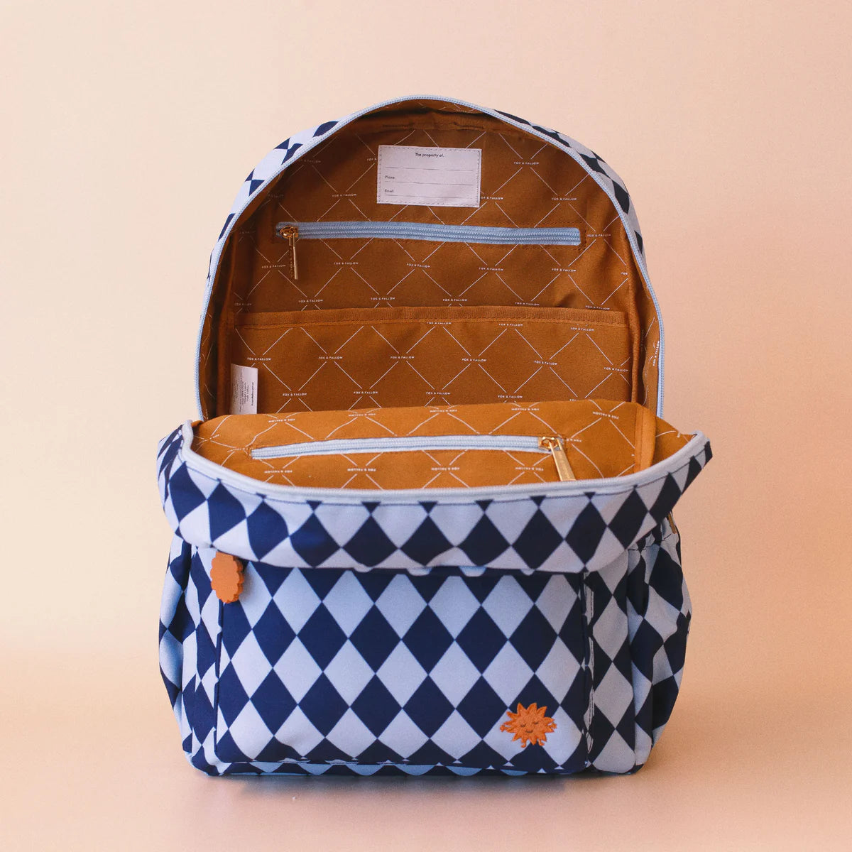 inside view of Fox & Fallow backpack for kids, perfect for school, daycare and everyday use. Spacious, practical and designed for little adventures. Personalisation of embroidery with name also available on bags in 2 placements. This print is blue diamonds