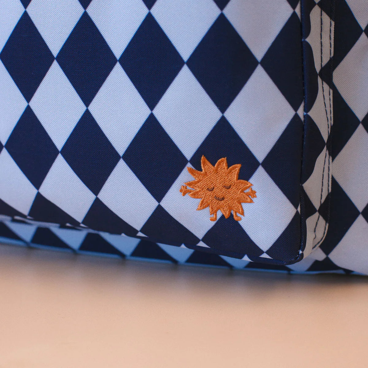 close up on Fox & Fallow backpack for kids, perfect for school, daycare and everyday use. Spacious, practical and designed for little adventures. Personalisation of embroidery with name also available on bags in 2 placements. This print is blue diamonds