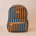 front view of Fox & Fallow backpack for kids, perfect for school, daycare and everyday use. Spacious, practical and designed for little adventures. Personalisation of embroidery with name also available on bags in 2 placements. This print is barcelona - mustard orange and navy blue stripes