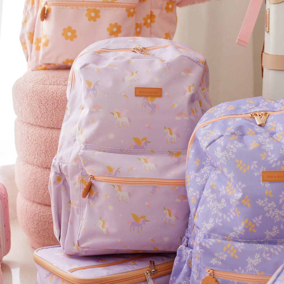 front view of Fox & Fallow backpack for kids, perfect for school, daycare and everyday use. Spacious, practical and designed for little adventures. Personalisation of embroidery with name also available on bags in 2 placements. This print is unicorns, juniper and daisy chain