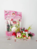 Packaged Bunny Berry Village KidDough sensory play kit in resealable pouch with green dough and themed bunny and strawberry accessories