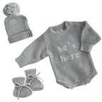 Blossom and Pear newborn baby boy announcement outfit with grey He’s Here knit romper set