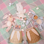Cozy Dinkum bunny doll lying down with fluffy textured suit