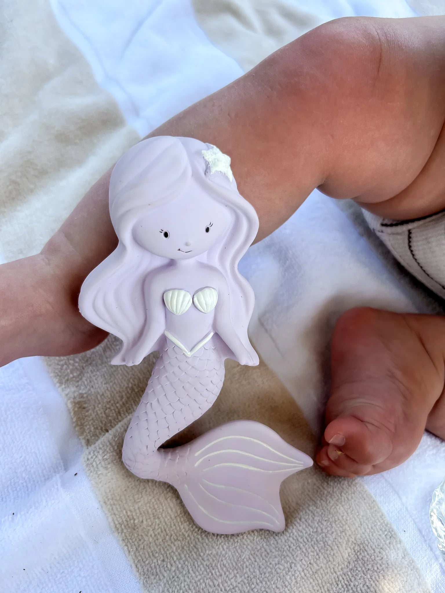 Baby holding Winnie Parkes Maeve the Mermaid teether