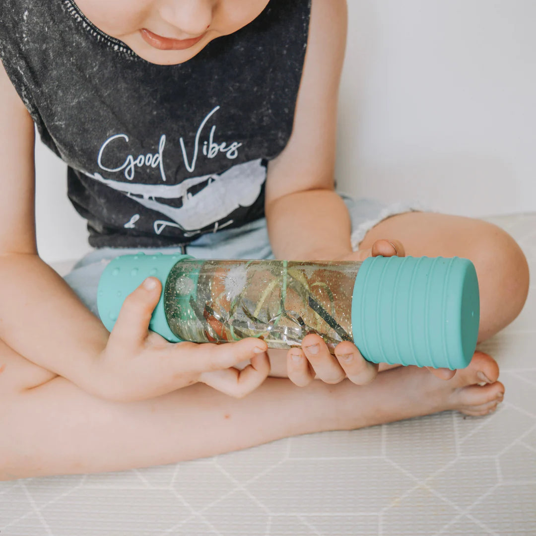 DIY sensory calm down bottle in mint by Jellystone Designs with reusable craft sensory elements