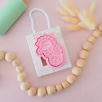 photoshoot image of playdough/clay stamp and cutter. Eco-friendly sensory play tool by brand playsense perfect for creative and imaginative play. can also be used for cookies and baking. pictured is baby seahorse