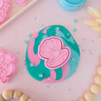showing a styled image of playdough/clay stamp and cutter. Eco-friendly sensory play tool by brand playsense perfect for creative and imaginative play. can also be used for cookies and baking. pictured is pearl shell