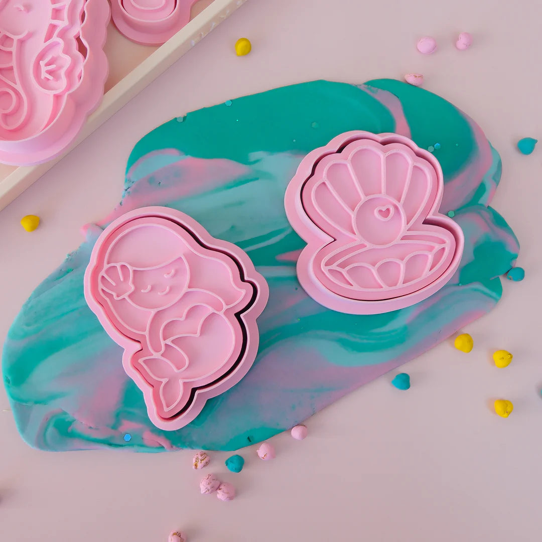 showing off image of playdough/clay stamp and cutter. Eco-friendly sensory play tool by brand playsense perfect for creative and imaginative play. can also be used for cookies and baking. pictured is mermaid and pearl shell
