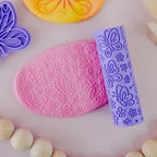 showing how to use Image of eco textured dough roller designed with fun patterns and to be used with sensory like playdough or can be used for cooking dough. Textured roller is in the pattern butterfly