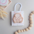 photoshoot image of playdough/clay stamp and cutter. Eco-friendly sensory play tool by brand playsense perfect for creative and imaginative play. can also be used for cookies and baking. pictured is skull and bones