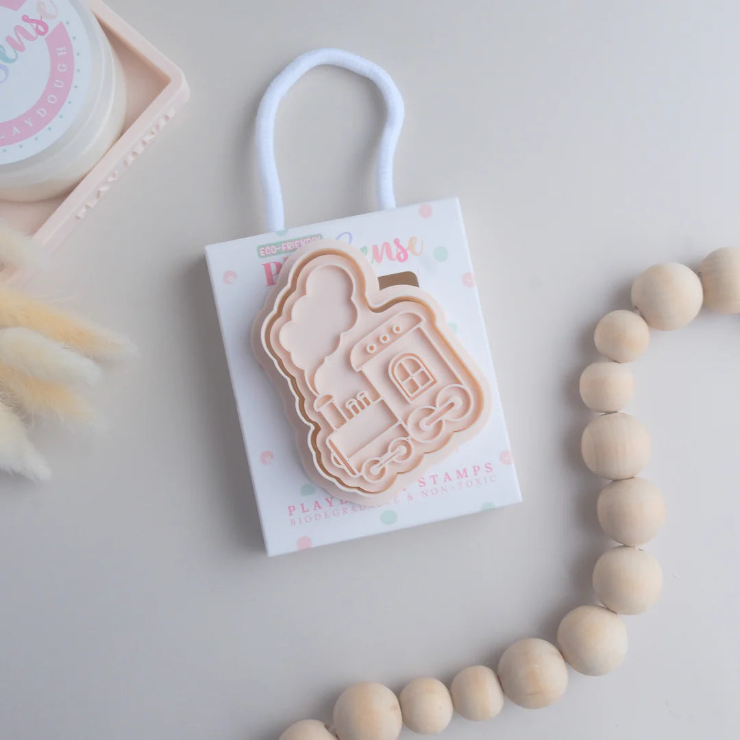 photoshoot image of playdough/clay stamp and cutter. Eco-friendly sensory play tool by brand playsense perfect for creative and imaginative play. can also be used for cookies and baking. pictured is steam train