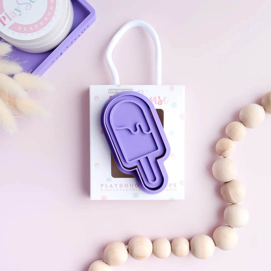 photoshoot image of playdough/clay stamp and cutter. Eco-friendly sensory play tool by brand playsense perfect for creative and imaginative play. can also be used for cookies and baking. pictured is popsicle