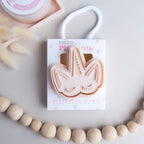 photoshoot image of playdough/clay stamp and cutter. Eco-friendly sensory play tool by brand playsense perfect for creative and imaginative play. can also be used for cookies and baking. pictured is unicorn face