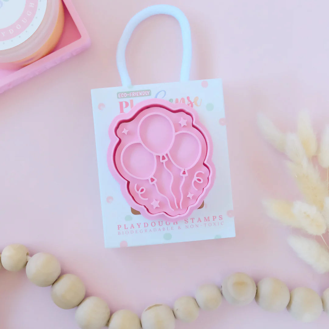  photoshoot image of playdoughc/clay stamp and cutter. Eco-friendly sensory play tool perfect for creative and imaginative play. can also be used for cookies and baking. pictured is balloons