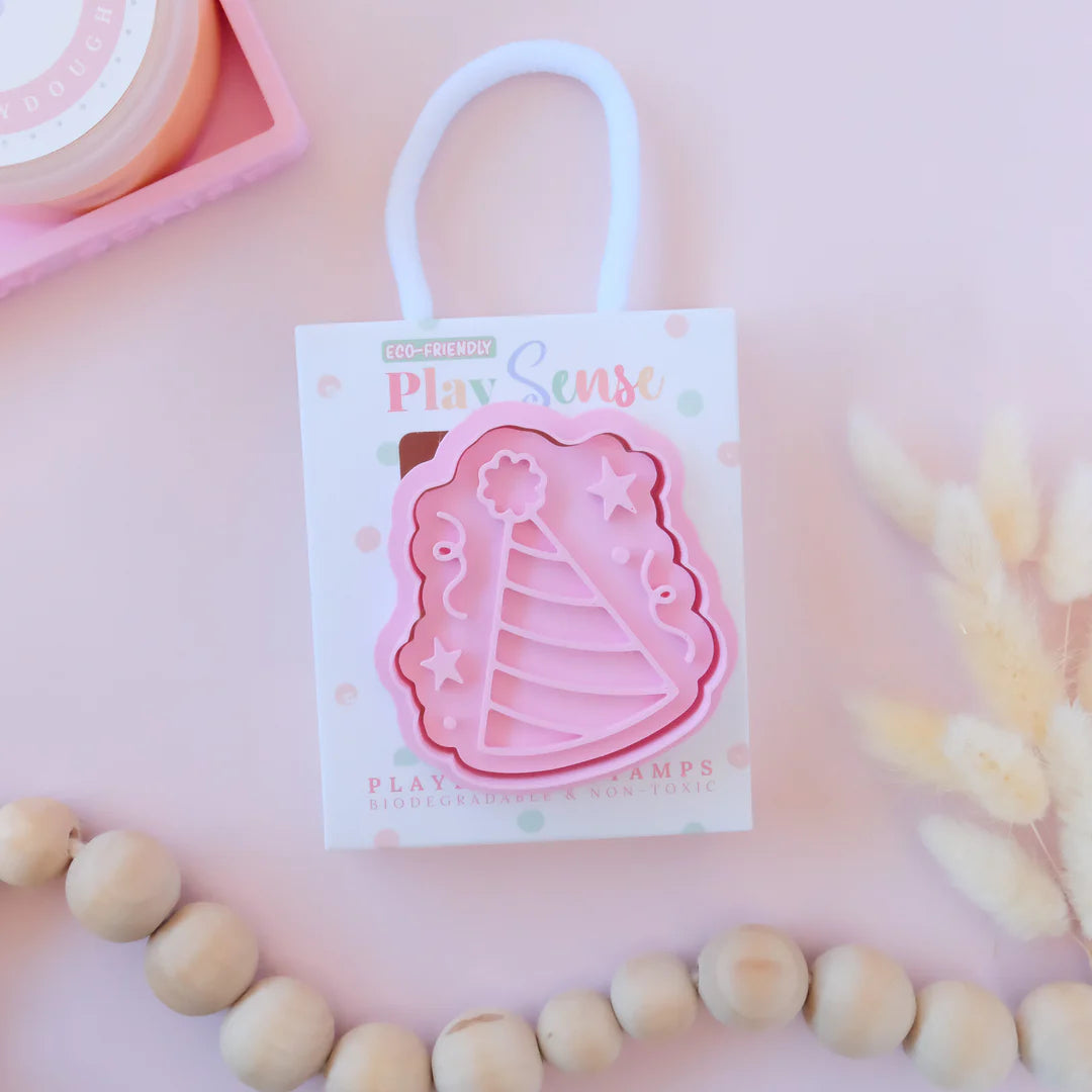 photoshoot image of playdoughc/clay stamp and cutter. Eco-friendly sensory play tool by brand playsense perfect for creative and imaginative play. can also be used for cookies and baking. pictured is party hat