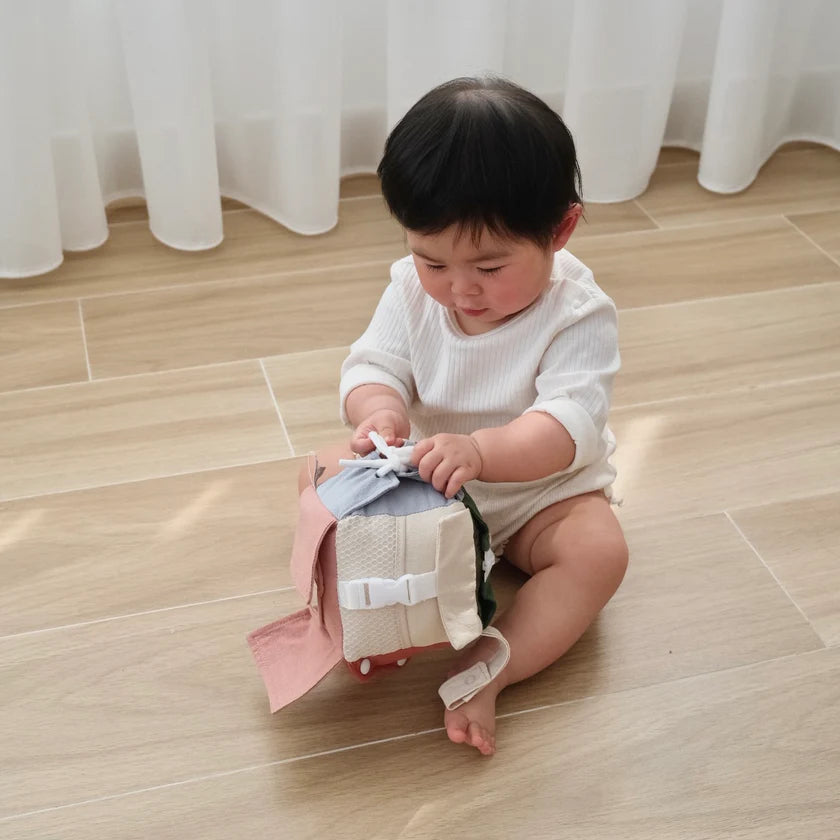 portable sensory activity cube with strap for stroller or on the go play