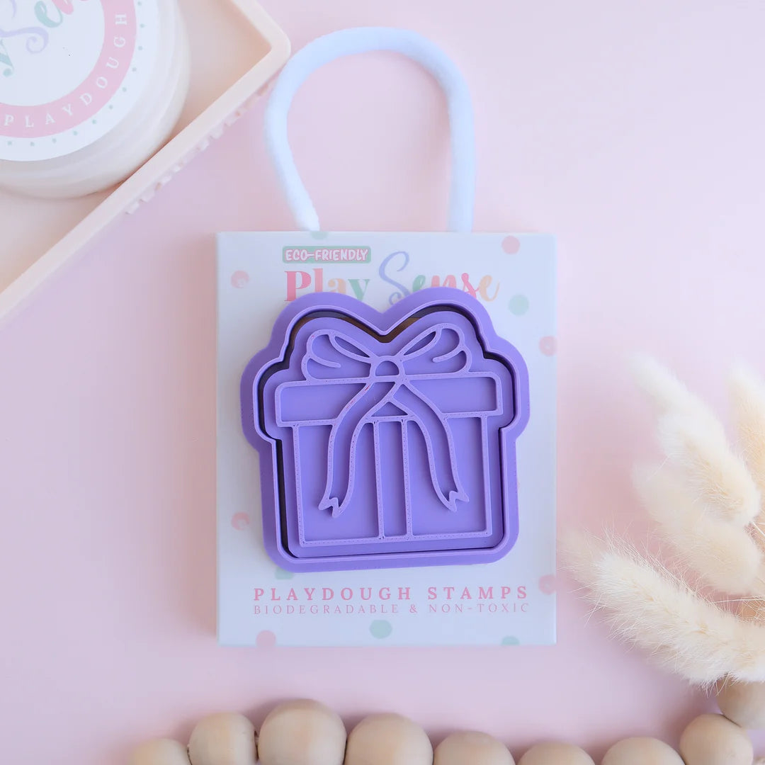 photoshoot image of playdough/clay stamp and cutter. Eco-friendly sensory play tool by brand playsense perfect for creative and imaginative play. can also be used for cookies and baking. pictured is present
