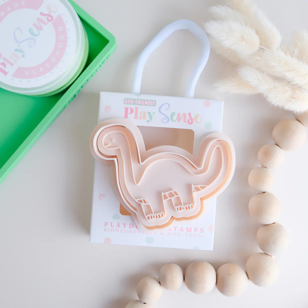 photoshoot of stock image of playdoughc/clay stamp and cutter. Eco-friendly sensory play tool perfect for creative and imaginative play. can also be used for cookies and baking. pictured is brachiosaurus