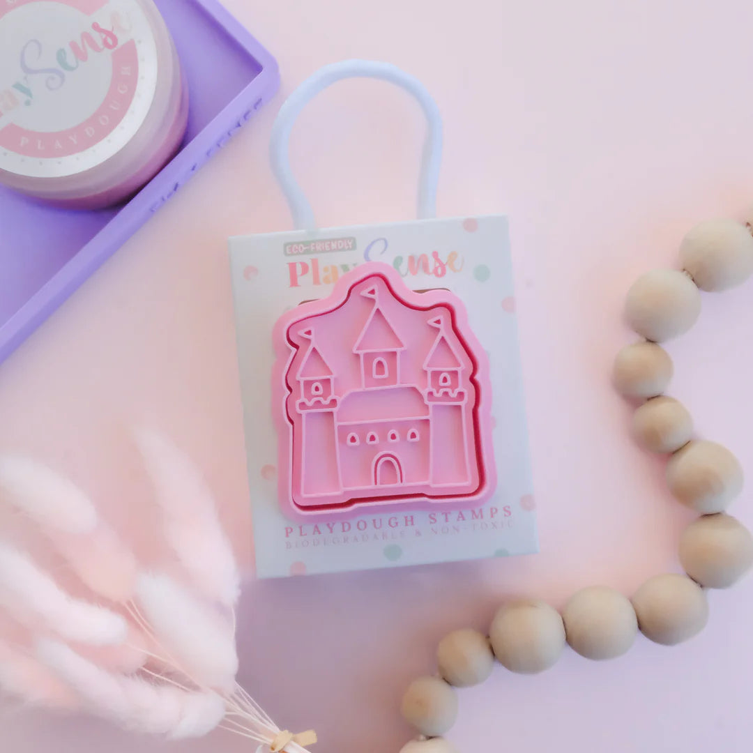 photoshoot image of playdough/clay stamp and cutter. Eco-friendly sensory play tool by brand playsense perfect for creative and imaginative play. can also be used for cookies and baking. pictured is princess castle