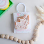 photoshoot image of playdough/clay stamp and cutter. Eco-friendly sensory play tool by brand playsense perfect for creative and imaginative play. can also be used for cookies and baking. pictured is excavator