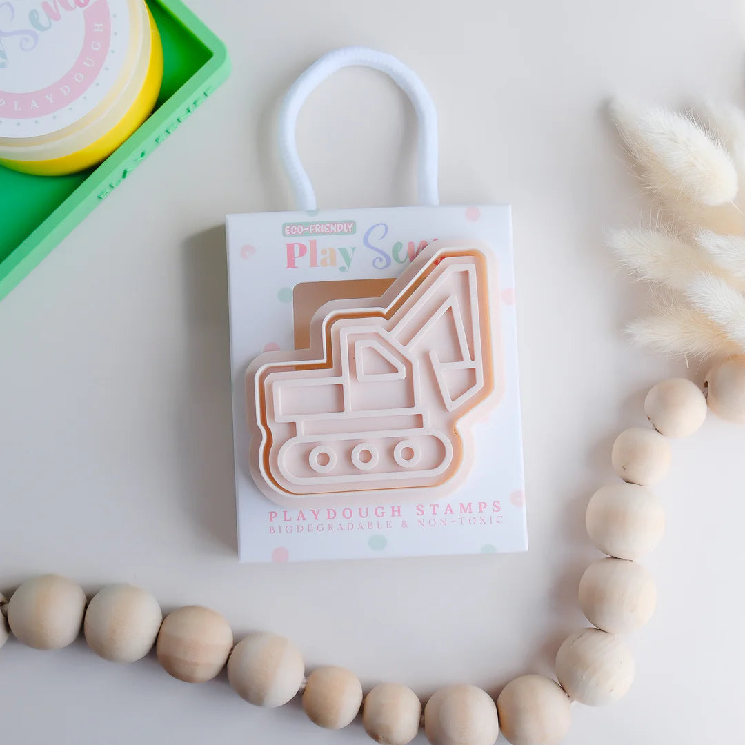 photoshoot image of playdough/clay stamp and cutter. Eco-friendly sensory play tool by brand playsense perfect for creative and imaginative play. can also be used for cookies and baking. pictured is excavator